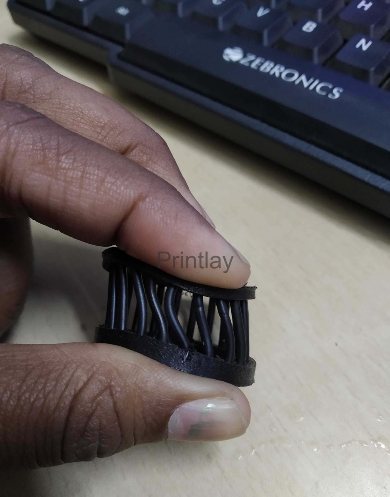 Flexible 3D printed component being flexed
