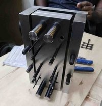 Tool and die components on a machining bench